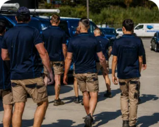 Plumbers walking to their service vans on a Hunters Hill job